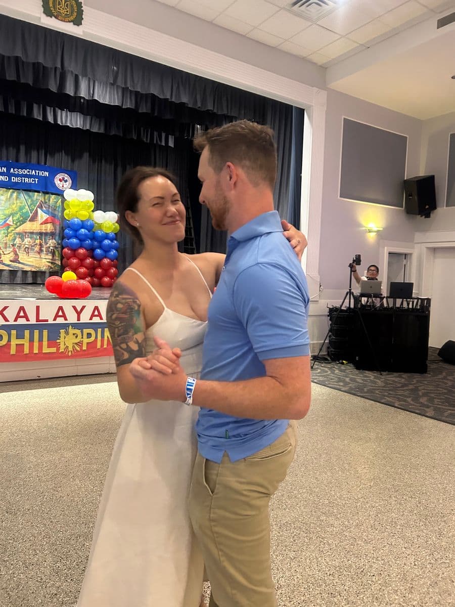 Ashley-Marie and Mitchell dancing at a Filipino community event